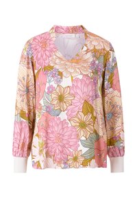 Blusa floral con escote en V, que presenta un patrón de flores en rosa y amarillo sobre un fondo blanco. Tejido suave con mangas largas y puños elásticos.