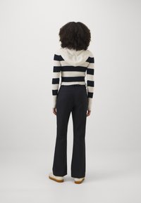 Tommy Hilfiger CORE FLARED PANT - Püksid - dark blue