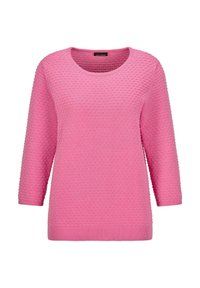 Rosa gestrickter Pullover mit einem strukturierten, gepunkteten Muster. Hat einen Rundhalsausschnitt und Dreiviertelärmel, die mit gerippten Kanten abschließen.