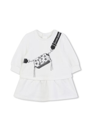 White long-sleeve baby dress with printed black crossbody bag and strap details on front, featuring floral decorations and text on strap.