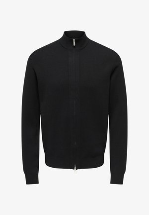 Svart strikket cardigan med høy krage og glidelås foran. Stoffet har en glatt tekstur med en tettsittende design og ribbestrikkede mansjetter.