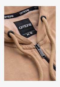 Sélectionné, beige