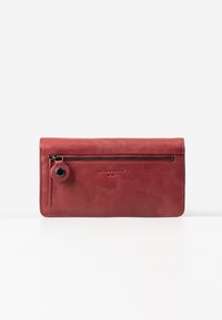 Red leather wallet with a smooth texture, zippered pocket, and embossed logo. Rectangular shape with contrasting black zipper detail.