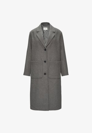 Hall suede segu sisse, mis on valmistatud hallist villasegust, millel on kergelt lõigatud krae, kolm nuppu ja kaks esipoolt taskut. Sile vooder sisemuses koos peente mustrite detailidega.