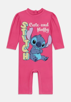 Pink one-piece outfit with long sleeves, featuring a graphic of Stitch, with the text “Cute and fluffy” in colorful, bold letters.