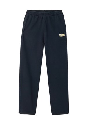 Pantalon de survêtement bleu marine avec une taille élastique, des jambes fuselées et un logo jaune sur la cuisse gauche ; fabriqué en matière douce mélange de coton.