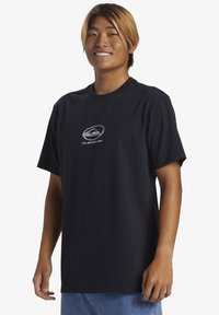 Black short-sleeve t-shirt made of cotton. Features a silver logo on the front. Crew neck design, relaxed fit, no visible patterns or accents.
