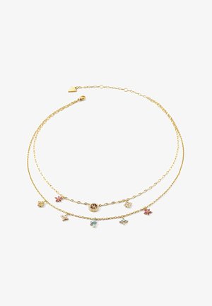 Collier délicat en double chaîne en or avec de petits charms floraux en pierres précieuses colorées et un pendentif central rond au design complexe.