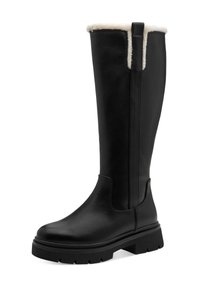 Botas de cuero negras hasta la rodilla con un suave forro de piel sintética color crema, suela gruesa de goma negra y una lengüeta en la parte trasera para facilitar su uso.