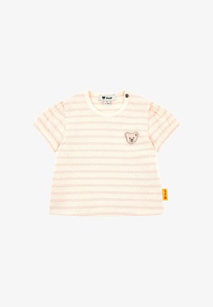 Chemise pour bébé à rayures crème et rose clair avec des manches courtes bouffantes, un petit patch en forme de visage d'ours sur la poitrine et une étiquette de marque jaune sur le côté.