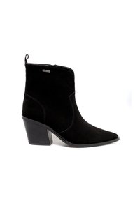 Must musta ankle saapad terava nina, külgsete tõmblukkudega ja keskmise plokkn צווישן. Omab õmblusteenuseid ja tõmbeantu taga.