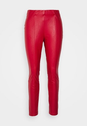Red faux leather pants with a slim fit, featuring an elastic waistband, smooth texture, and vertical seams for added shape.