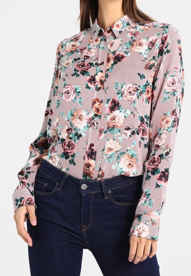 Blusa con motivo floreale su sfondo a righe, nelle tonalità di rosa, verde e nero. Design con maniche lunghe e colletto abbottonato.
