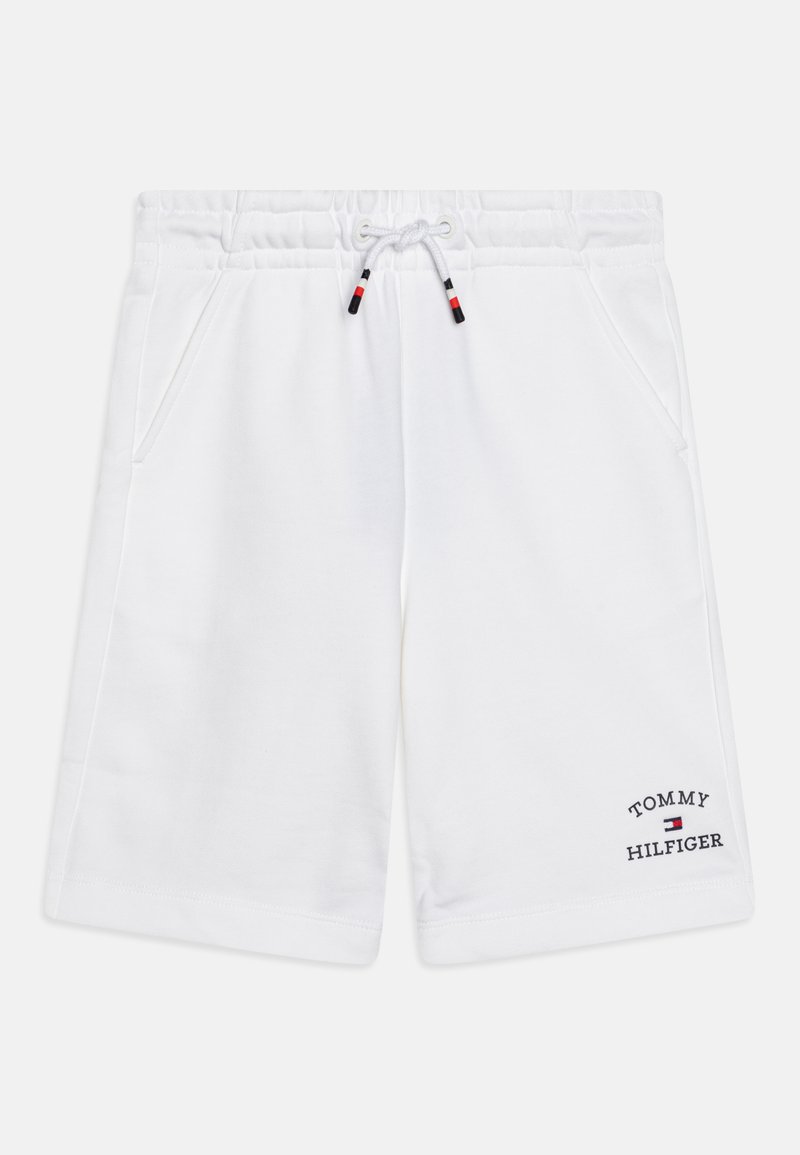 Pantaloni corti bianchi in cotone con vita elastica e coulisse. Presenta tasche laterali e logo ricamato "TOMMY HILFIGER" sulla gamba.