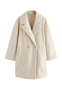 Beige, dupla gombos kabát, melynek horgolt gallérja van, texturált anyagból készült. Két oldalsó zsebe és széles ujja van.