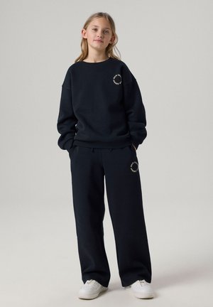 Name it, NKFRIA WIDE SWEAT PANT BRU NOOS - Tepláky - black detail antique white print