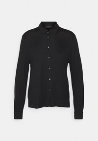 Svart långärmad skjorta med krage, framknäppning och ribbade manschetter. Tillverkad av mjukt tyg, slät yta, minimalistisk design.