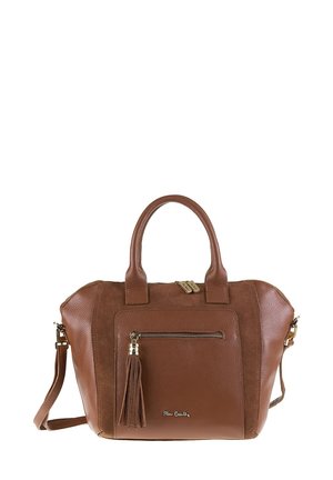 Sac à main en cuir brun et en daim avec doubles poignées, poche zippée avant avec pompon, et bandoulière amovible.