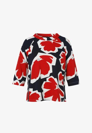 Women's short-sleeve top with red and white abstract floral pattern on black background and a round neckline.