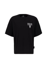 T-shirt en coton noir avec une coupe oversize. Présente le texte "BERLIN" et un graphique de ballon en blanc, avec des manches courtes et un col rond.