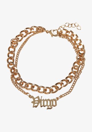 Kuldse tooniga kihiline kaelakee, millel on paks kett ja õrn kett, kaunistatud dekoratiivse "Neitsi" pendandiga gooti fondis.