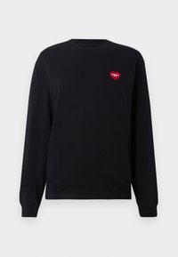 Black long-sleeve sweatshirt made of cotton. Features a small red heart logo on the left chest area. Simple design with ribbed cuffs.