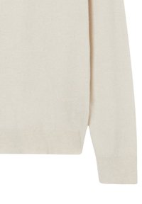 Hellbeiger Pullover mit weicher Textur, langen Ärmeln und geradem Saum. Verfügt über einen Rundhalsausschnitt sowie gerippte Bündchen und Saum.