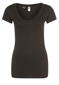 Svart, figurnära, kortärmad t-shirt med rundad halsringning, tillverkad av mjukt bomullsmaterial, med en liten logotyp på vänster sida.