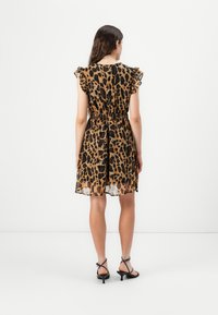 Leopard-print dress in lightweight, sheer fabric. Features ruffled sleeves, elastic waist, and a slightly flared hem at mid-thigh length.