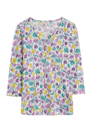 Floral print top with a v-neck, featuring purple, yellow, and teal tulip designs on a white background. Made from lightweight fabric.