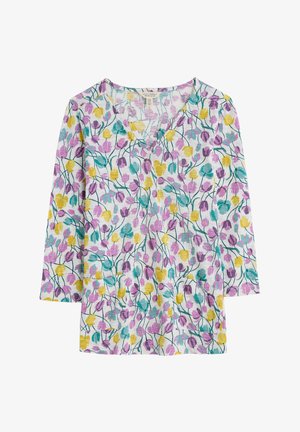 Ziedu raksta tops ar V-veida kaklu, ar purpursarkanām, dzeltenām un teāla tulpju zīmējumiem uz balta fona. Izgatavots no viegla auduma.