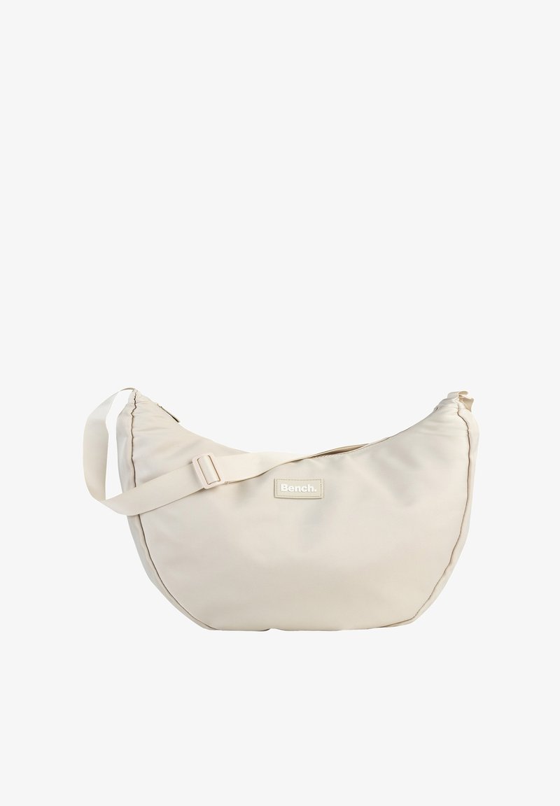 Beige Hobo-Tasche aus strukturiertem Nylon, mit verstellbarem Tragegurt und gesticktem Logo-Patch. Runde Form mit Reißverschluss.