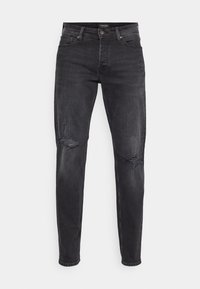 Slim fit svarta jeans med slitna hål vid båda knäna, framknäppning och femfickdesign.