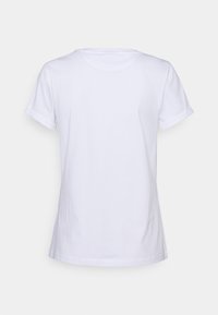 Hvid bomulds t-shirt med rund halsudskæring, korte opsmøgede ærmer og en enkel, glat tekstur. Ingen synlige mønstre eller detaljer.