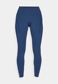 Marineblå leggings laget av elastisk stoff, med høy midje og to sidelommer for oppbevaring. Glatt tekstur med flate sømmer.