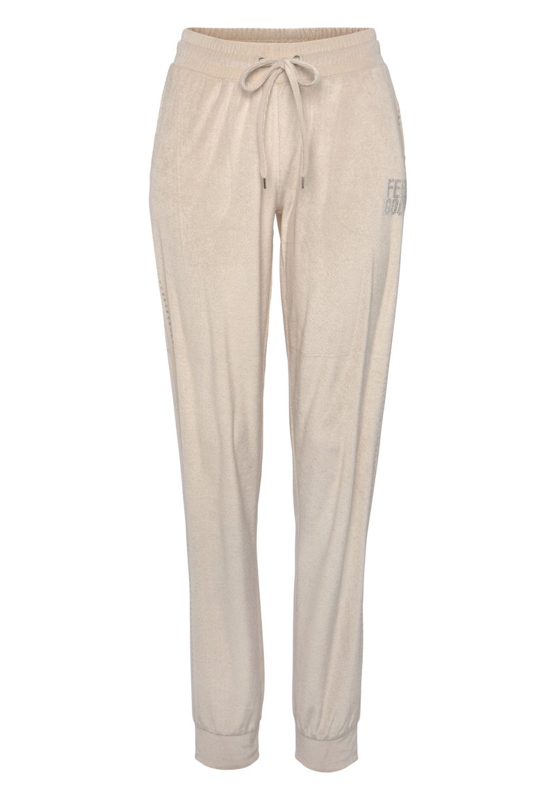Lichtbeige joggers met een zachte textuur, elastische tailleband en verstelbare trekkoord. Voorzien van zijzakken en een subtiele print op één been.