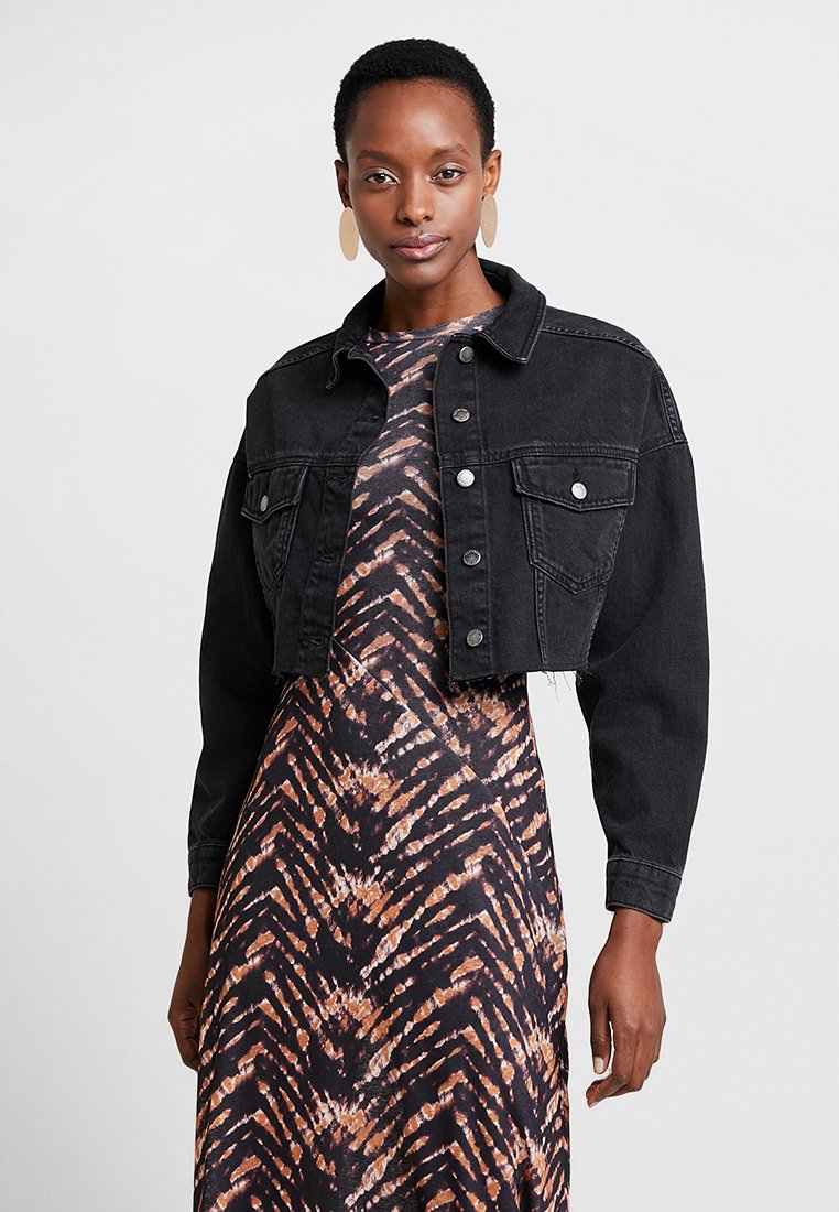 hacked off cropped denim jacket