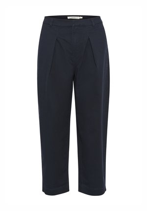 Chinos blu navy con un taglio morbido, pieghe frontali e orli risvoltati. Realizzati in tessuto misto cotone, dotati di passanti per cintura e tasche laterali.