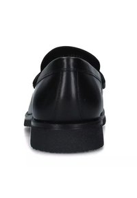 Scarpa in pelle nera con forma arrotondata, finitura opaca e suola in gomma piatta. Presenta un design semplice senza hardware o dettagli visibili.