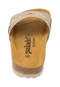 Kork-sula slide sandal med en ljus beige syntetisk rem som har subtila präglingar på en brun innersula, märkta med "palado."