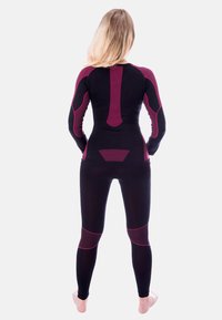 Black athletic suit with long sleeves and leggings, featuring burgundy accents, textured panels, and a form-fitting design.