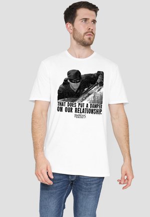 White cotton t-shirt featuring a black and white graphic print with text: "That does put a damper on our relationship." Short sleeves.