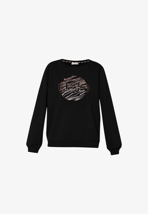 Felpa nera con maniche lunghe, collo rotondo e un design grafico circolare in bianco e arancione che imita le strisce zebrate. Texture liscia.