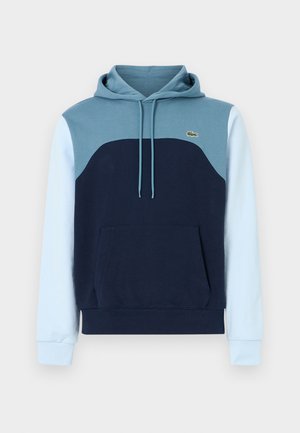 Kapuzensweatshirt mit einem Farbblock-Design in Marineblau, Hellblau und Türkis. Verfügt über eine Vordertasche und eine Kapuze mit Kordelzug.