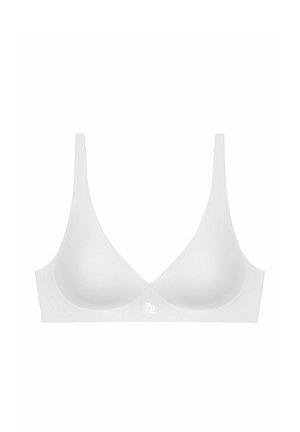 Soutien-gorge blanc avec une texture lisse, un design sans coutures et des bonnets doux. Dispose de bretelles fines et d'un logo discret au centre.