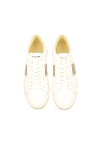 White leather sneakers with a beige stripe, round toe, and flat laces. Smooth finish, minimalistic design, and cushioned interior.