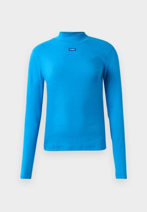 Bright blue ribbed long-sleeve top with mock neckline and small "HUGO" label centered below collar.