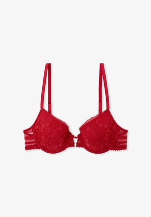 Soutien-gorge en dentelle rouge avec bonnets rembourrés, bretelles réglables, motifs floraux, bordure festonnée et une fermeture à agrafes au centre avant.
