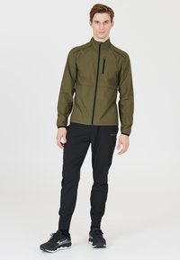 Endurance HUGOEE - Løbejakker - ivy green