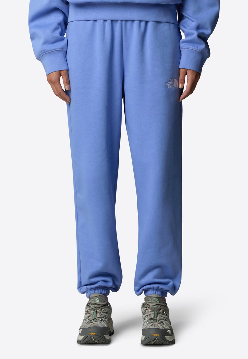 Hellblaue Sweatpants mit elastischem Bund und Knöchelbündchen, mit dezentem Logodetail. Hergestellt aus weichem Baumwollmischgewebe.